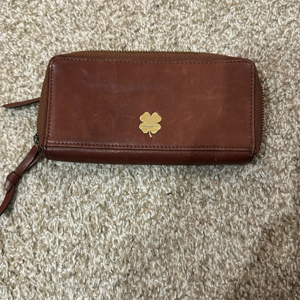 Lucky brand 100 percent leather exterior zip around wallet